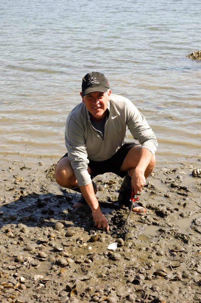 Steve Russell participating in ocean clean up efforts.